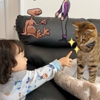 ソファに立っている猫と猫を指さしている子ども
