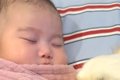 ぐっすりと眠る赤ち…の画像