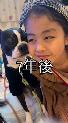 女の子の顔に自分の顔を寄せる犬